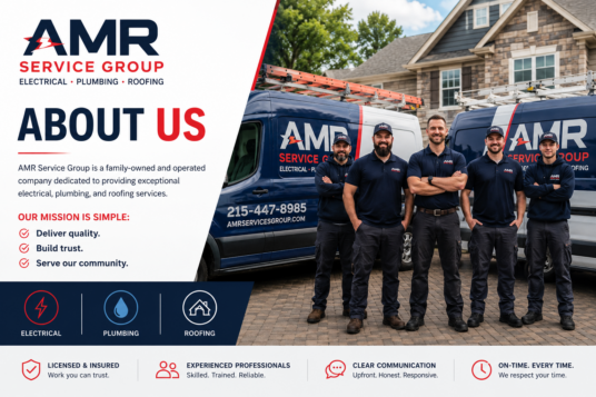 Five technicians posing in front of service vans